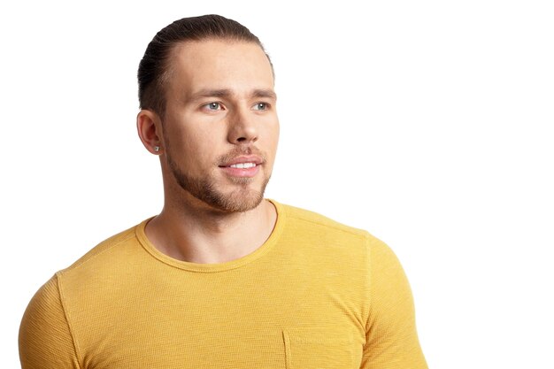 Portrait of young man posing on white background