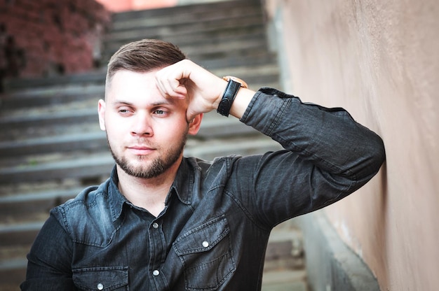 Portrait of a Young man in a shirt and trousers