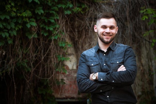 Portrait of a Young man in a shirt and trousers