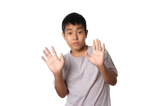 Portrait of young man show stop gesture sign by hand hands show refusal gesture Human emotion face expression concept Studio shot isolated on white background copy space