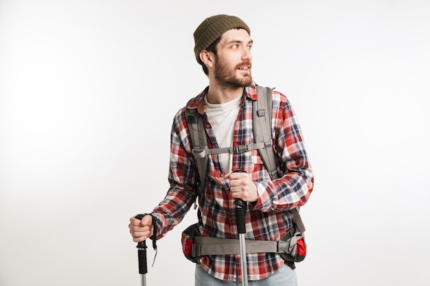 Portrait of a young man tourist carrying backpack