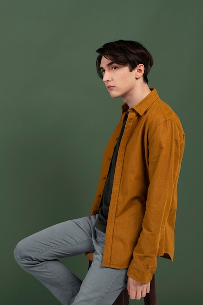 Portrait young man wearing shirt posing