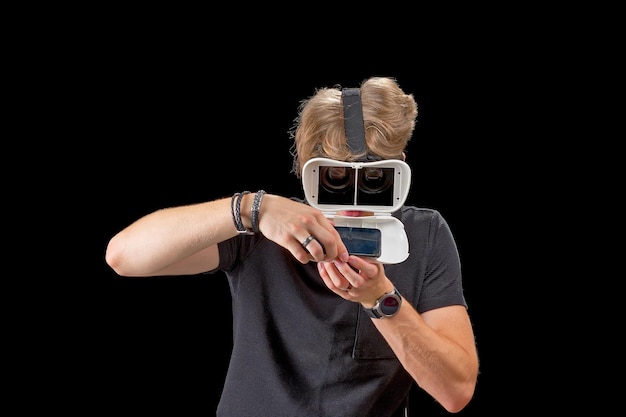 Portrait of a young man with 3D virtual reality glasses Young man using vr headset VR goggles