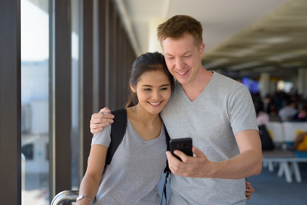 Portrait of young multi-ethnic couple enjoying vacation together