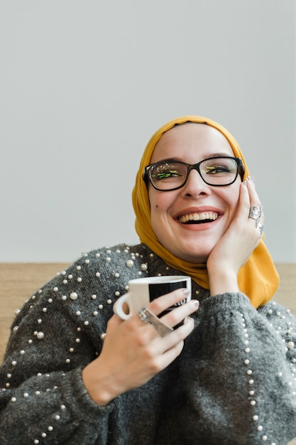 Portrait of young muslim woman laughing