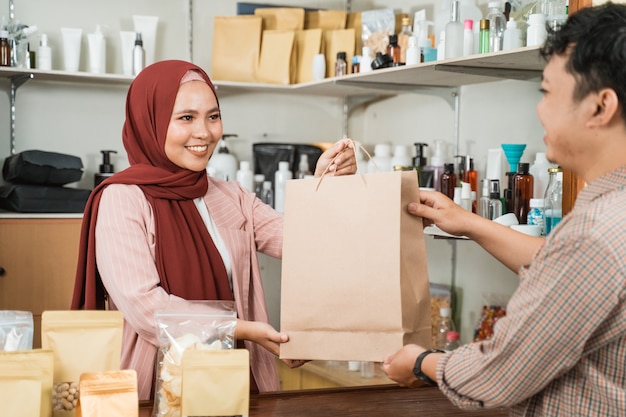 Portrait of young Muslim woman in a store