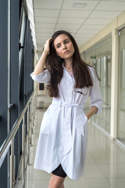 Portrait of young nurse in clinic. Conception of healthcare.