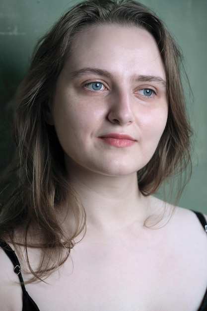 Portrait of a young pretty attractive brownhaired girl