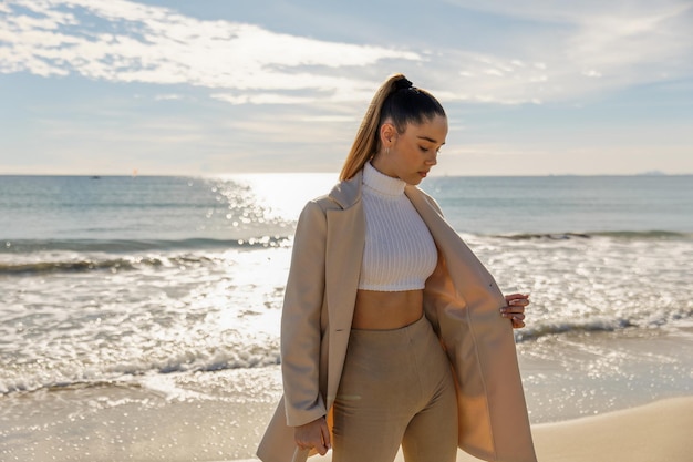 Portrait of a young pretty girl on the background of the sea