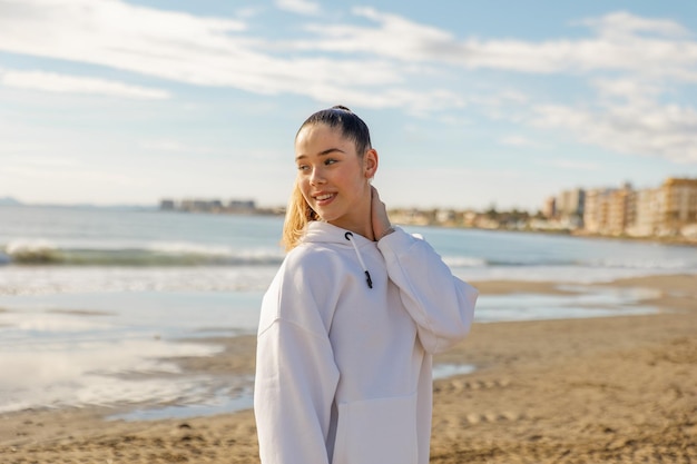 Portrait of a young pretty girl on the background of the sea