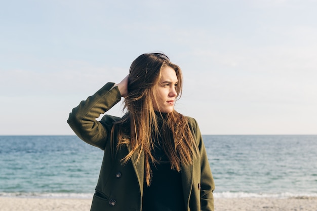 Portrait of a young pretty woman in a coat