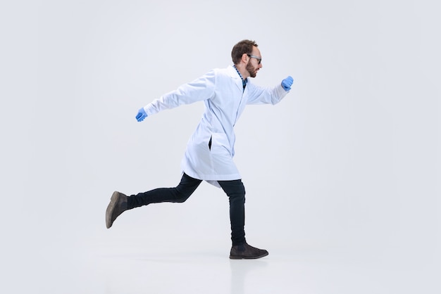 Portrait of young scientist, chemist or doctor conducts chemical research at pharmaceutical lab.