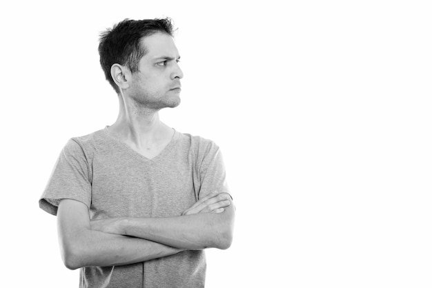 Portrait of young skinny man isolated on white in black and white