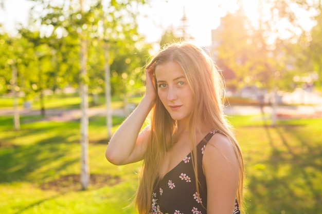 Portrait Of Young Smiling Beautiful Woman. Close-up portrait of a fresh and beautiful young fashion model posing outdoor