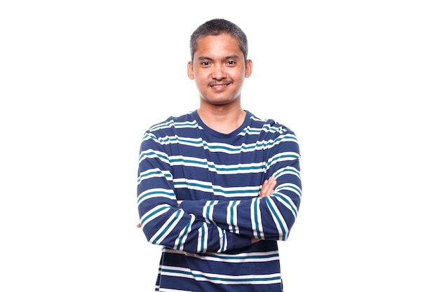 Portrait of young smiling man with crossed arms isolated on white background