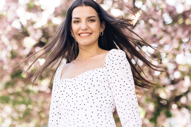 portrait young smiling woman with long hair look at camera smile portrait happy summer face