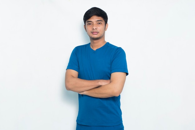 Portrait young sporty man dressed in blue tshirt on white background