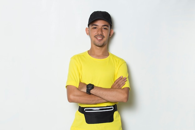 portrait young sporty man dressed in yellow tshirt on white background