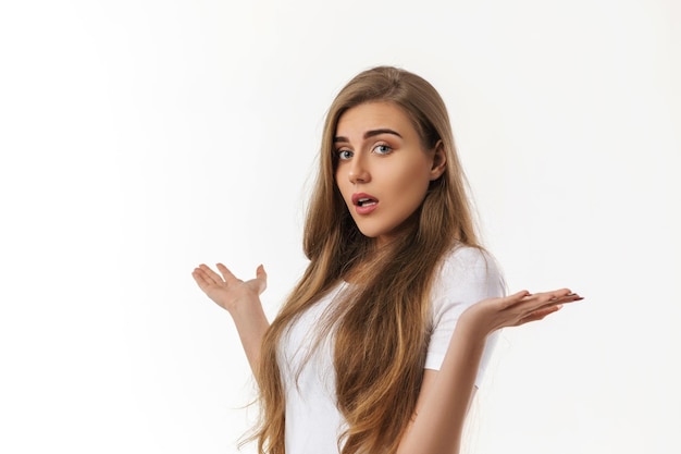 Portrait of young surprised beautiful woman