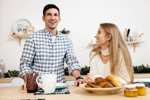 Portrait of a young sweet couple in kitchen