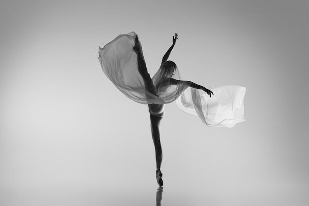 Portrait of young talented ballerina dancing performing Classic and modernity Black and white