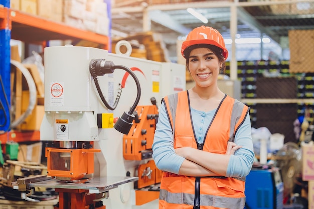 Portrait young teen Asian woman machine engineer working in heavy industry happy smiling confident