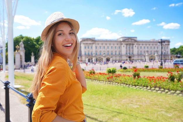 Portrait of young tourist woman visiting London United Kingdom Looking at camera