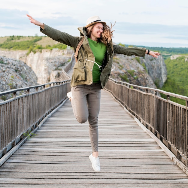 Portrait of young traveler on a bridge