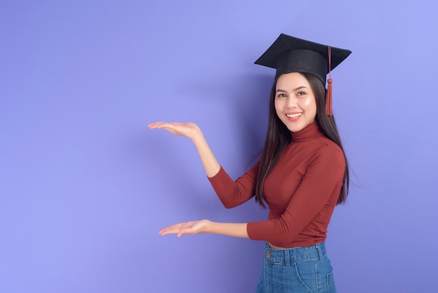 Portrait of young University student woman with graduation cap 