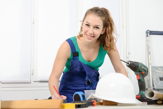 Portrait of young woman apprentice carpenter