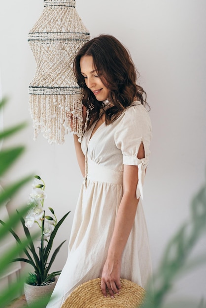 Portrait of a young woman in a bright home interior