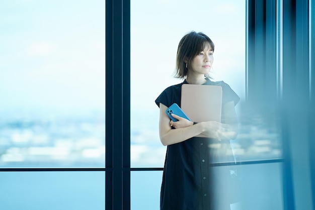 portrait of a young woman by the window