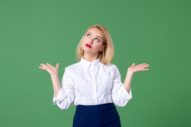 portrait of young woman in conservative clothing green wall lesson teacher school study college