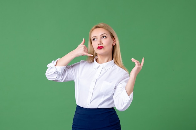 portrait of young woman in conservative clothing green wall school lessons student teacher study