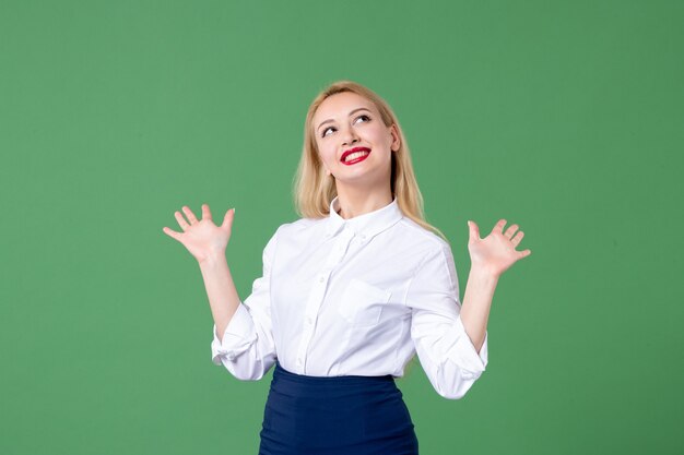 portrait of young woman in conservative clothing green wall school teacher student lesson