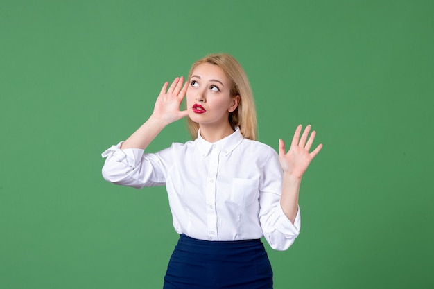 portrait of young woman in conservative clothing green wall teacher lesson study