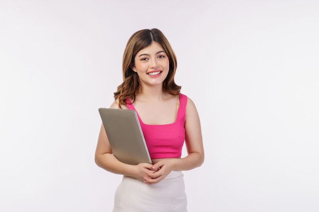 Portrait of young woman holding laptop computer isolated over white background