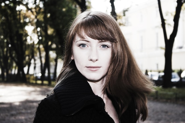 Portrait of young woman in park