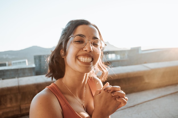 Portrait of young woman on sport clothes after a workout training outdoors happy lifestyle sport Portrait of happy fit people Sport people workout concept during sunset super smile and glasses