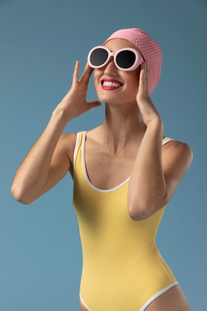 Portrait of young woman in swimsuit at the studio