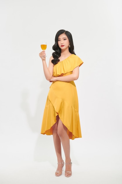 portrait young woman wearing elegant dress with glass of wine