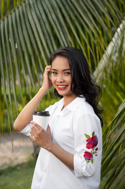 Portrait of young woman wearing embroidered shirt