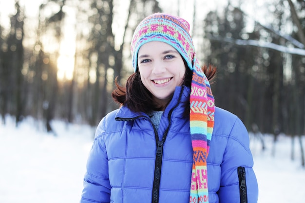 Portrait of a young woman in winter park