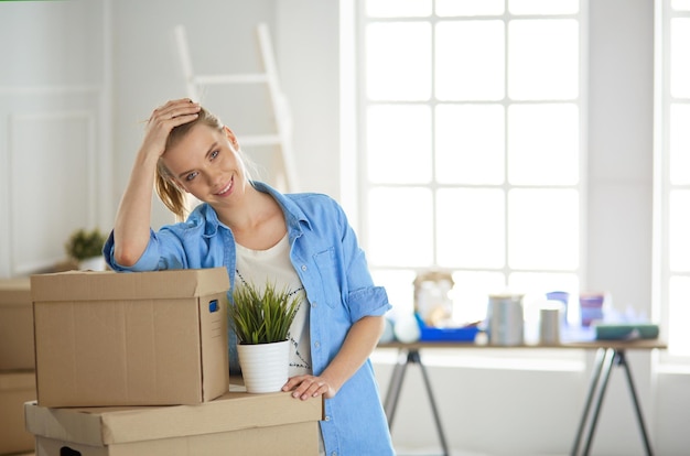 Portrait of a young woman with boxes