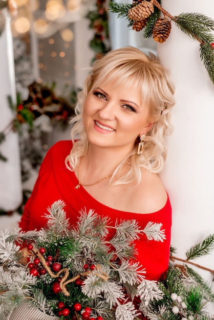 Portrait of a young woman with a Christmas composition