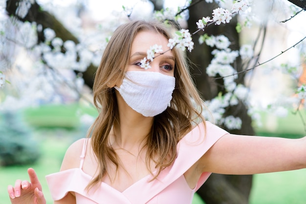 portrait young woman with mask in garden