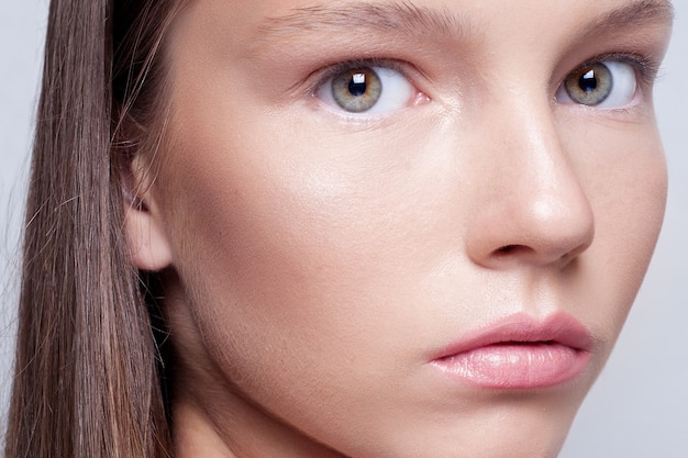 Portrait of young woman with natural makeup