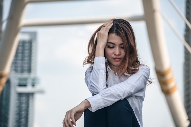 Portraits of beautiful asian woman stressed from work.