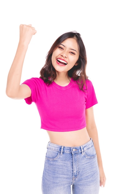 Portraits of young Asian women. Raise arms. With a smiling face happily, a beautiful woman with a sense of self-confidence, looks good, happy on a gray background.