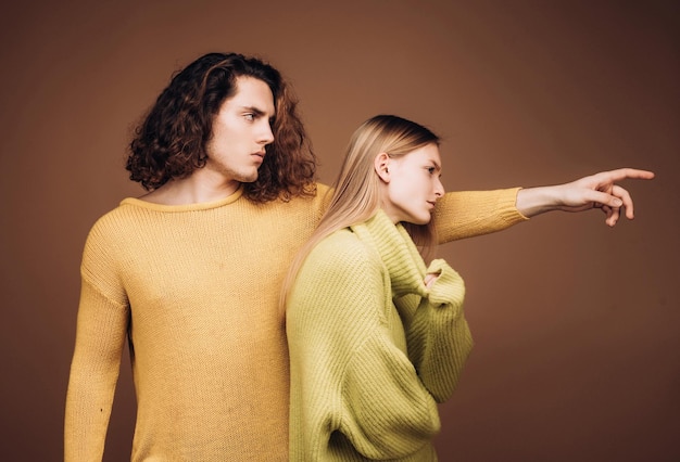 Photo portret of stylish confident male and female models with nature hairstyle wearing a yellow and green